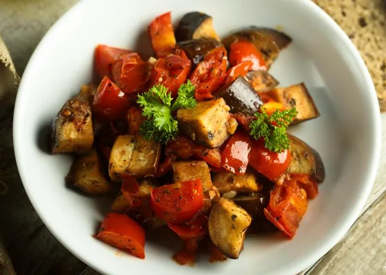 A bowl of caponata with eggplant and red peppers