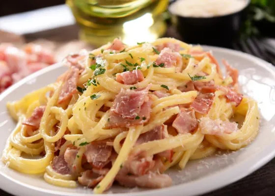 Spaghetti alla Carbonara with guanciale, grated cheese and black pepper